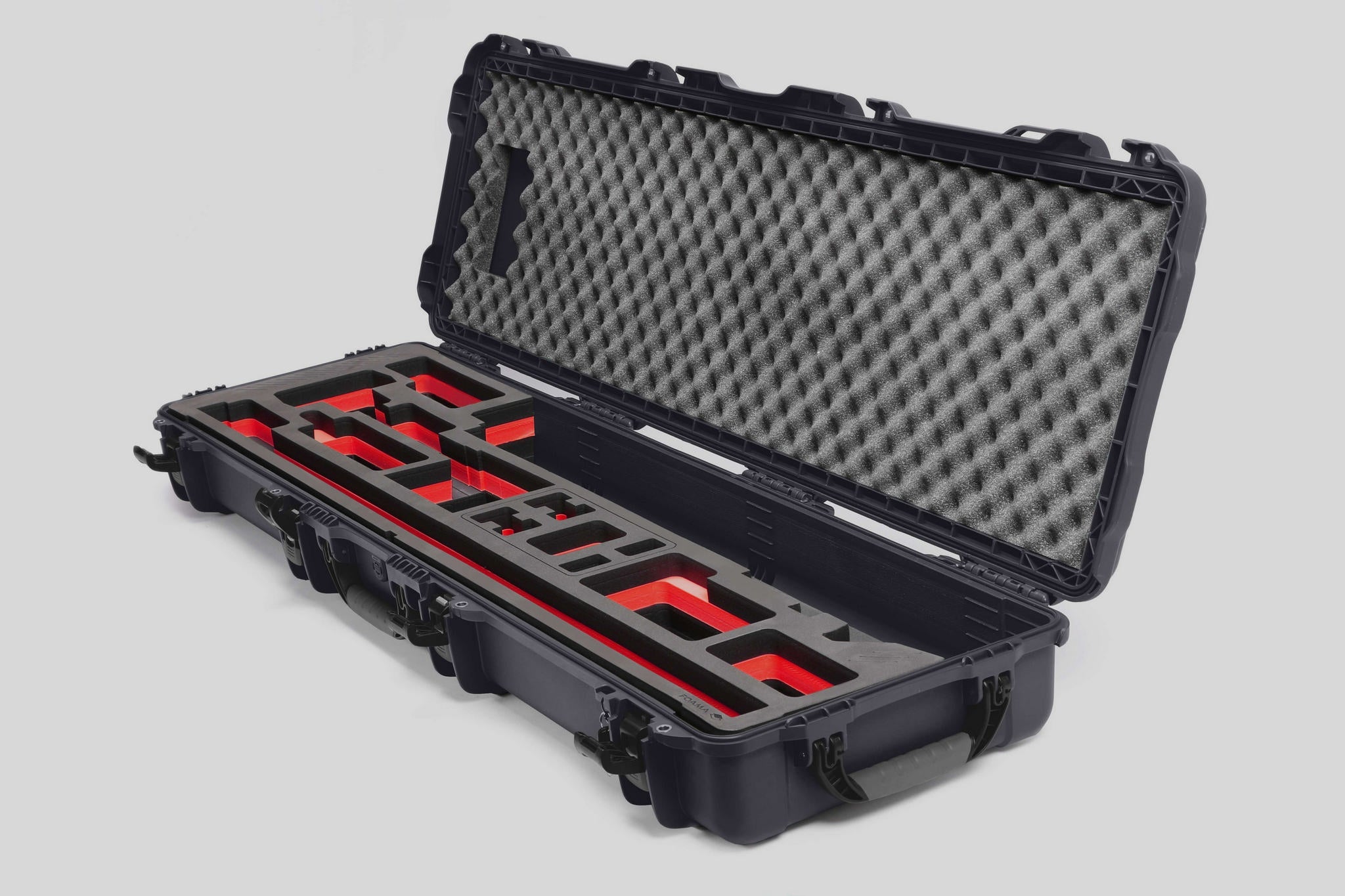 Angled view of Foama Fortified Graphite Color Hard Case and Custom Foam Insert with Red Layer for DJI D-RTK 2 Mobile Station